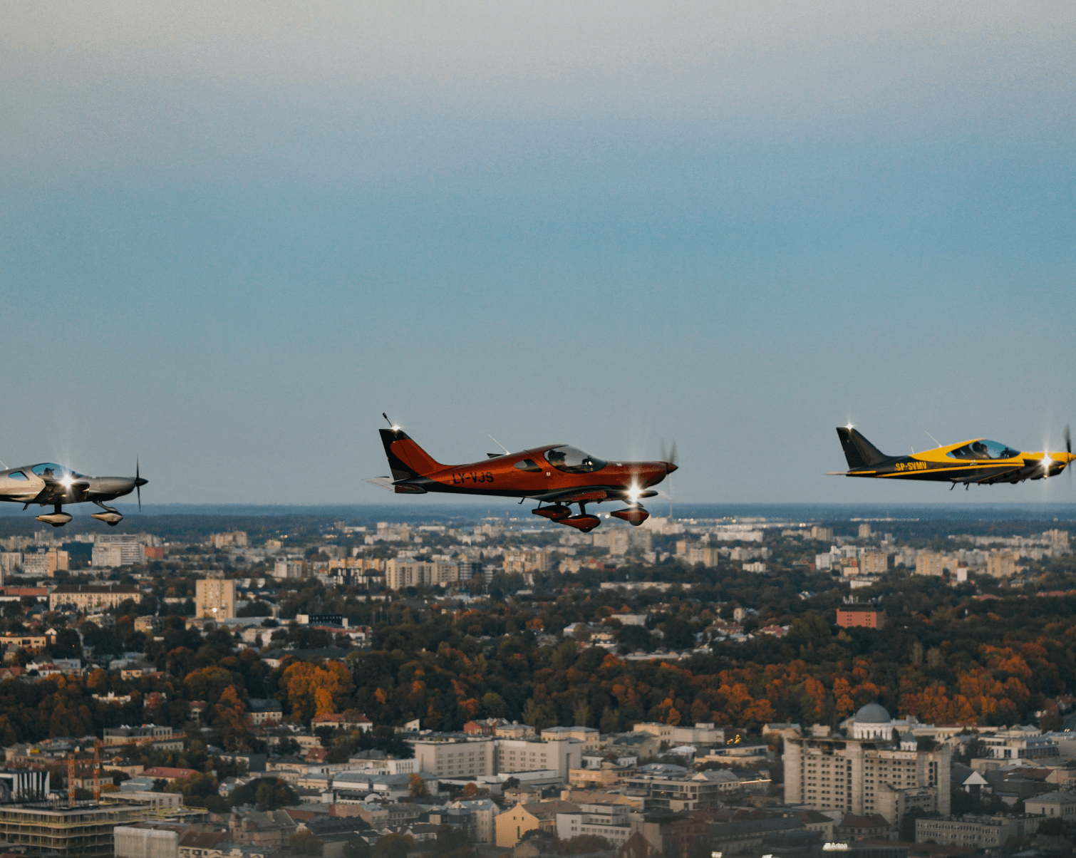 Aircraft above city skyline