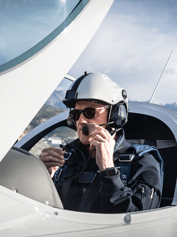 Pilot in cockpit with sunglasses